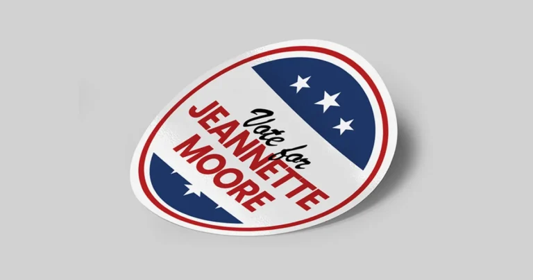 Red, white and blue oval campaign sticker reading "Vote for Jeannette Moore"