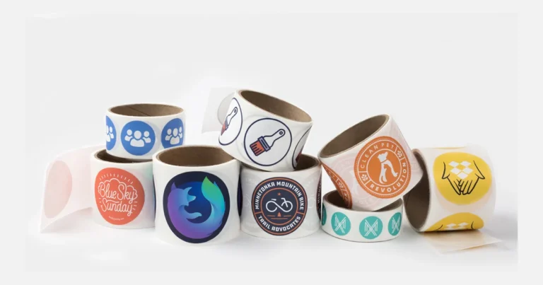 Rolls of round custom logo stickers stacked together