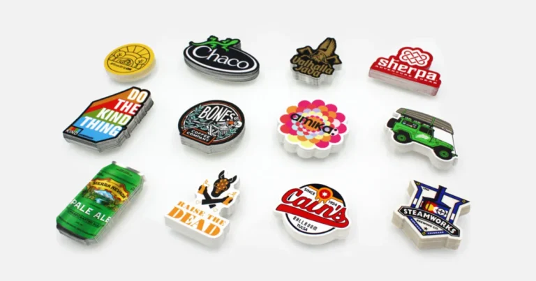 Stacks of die-cut logo stickers cut to the shape of each design