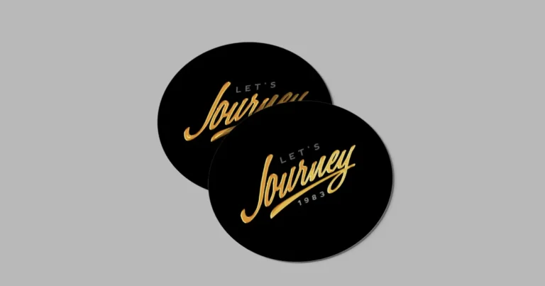Two black oval stickers with gold foil script lettering