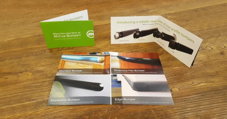 French fold product brochure shown folded and opened on a wooden table