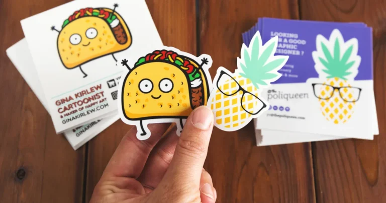 Hand holding cartoon taco and pineapple kiss-cut stickers above their backing sheets