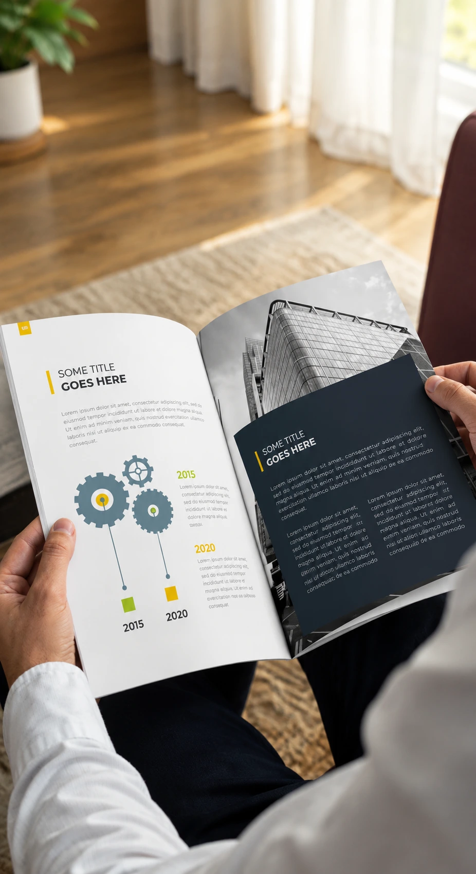 Hands holding an open printed catalog with a building photo spread